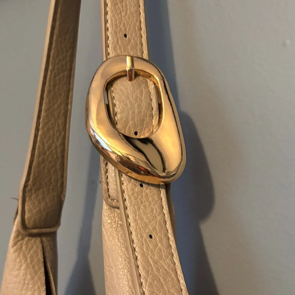 Anthropologie Beige love knot buckle Hobo Bag